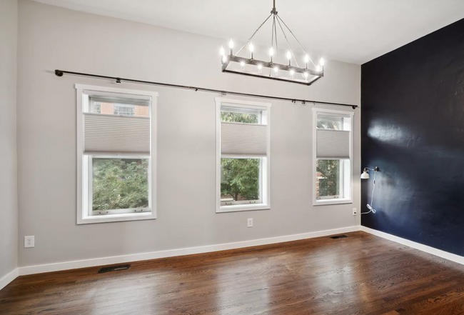 West facing main bedroom with Restoration Hardware chandelier. - 829 3rd St NE