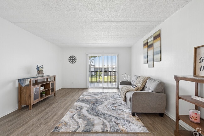 2BR, 1BA - 1,050SF - Living Room - Villas at City Center