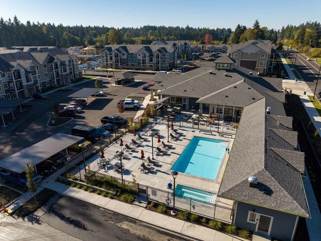 Dive into Modera Lacey’s tranquil resort-style pool and unwind in our heated spa. - Modera Lacey