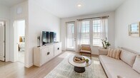 Located at 1700 Ranch Road in Nokomis, Florida, this one-bedroom, one-bathroom residence offers a thoughtfully designed single-floor layout filled with natural light and contemporary finishes. The open-concept living area seamlessly connects the kitchen, dining, and living spaces, creating an inviting and functional hub. The kitchen is well-appointed with white shaker cabinetry, granite countertops, stainless steel appliances including a range, microwave, dishwasher, and refrigerator, and a peninsula with bar seating illuminated by sleek pendant lighting. Light wood-style flooring flows throughout the main living areas, complementing the bright, neutral color palette. The living room features large windows that flood the space with natural light and provide outdoor views. The bedroom offers a comfortable retreat with plush carpet, dual windows, a ceiling fan, and direct access to a spacious walk-in closet with wire shelving. The bathroom includes a granite-topped vanity, a large mirror, and a separate walk-in closet entry. Additional highlights include a private balcony, a dedicated laundry area, and two closets for ample storage. The overall ambiance is clean, modern, and airy — ideal for comfortable Florida living.