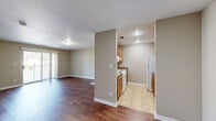 Located at 200 Walrose Circle in Searcy, Arkansas, this single-story, 2-bedroom, 2-bathroom home offers a practical and well-organized layout across a comfortable footprint. Warm neutral tones carry throughout the interior, complemented by wood-look vinyl flooring in the main living areas and cozy carpet in the bedrooms.

The living room provides an open, airy feel with clean lines and easy access to the adjacent dining area. The kitchen features warm-toned wooden cabinetry, dark countertops, a double basin sink, and white appliances including a refrigerator, dishwasher, and range — all neatly arranged in an efficient galley-style layout.

Both bedrooms are carpeted and finished in soft neutral hues, each offering natural light through large windows fitted with vertical blinds. The primary bedroom includes a dedicated closet, while additional closet space is available throughout the unit. Each of the two bathrooms is equipped with a wooden vanity, white countertop, a well-lit mirror, and wood-look flooring, maintaining a consistent and clean aesthetic.

A dedicated laundry area and utility room add functional convenience. A hallway connects the key areas of the home, contributing to a logical and easy-to-navigate floor plan. This home provides a clean, move-in-ready environment suited for comfortable everyday living.