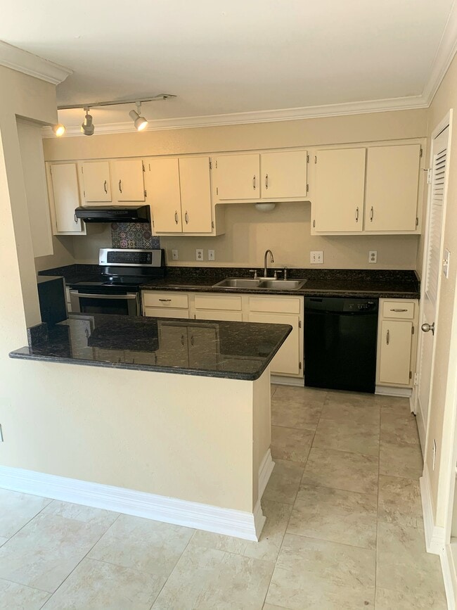 Kitchen with stove, fridge, microwave, dishwasher - 5801 Lumberdale Rd