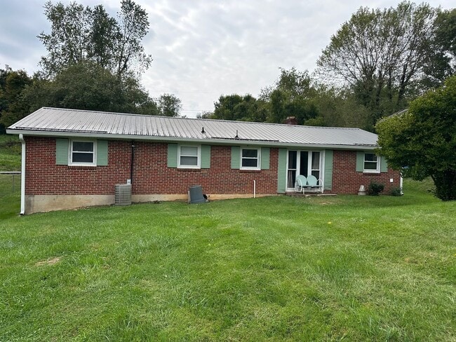 Building Photo - ONE LEVEL BRICK RANCHER WITH EXTRA LARGE LOT