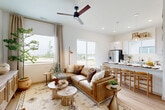 Located in Omaha, Nebraska, this well-appointed single-story home offers two bedrooms and three bathrooms, thoughtfully designed with a clean, modern aesthetic and warm natural tones throughout. The open-concept kitchen and living area serves as the heart of the home, featuring white shaker cabinetry, stainless steel appliances, a sleek island with pendant lighting, and light hardwood flooring that carries seamlessly through the space. The living room is bright and inviting, bathed in natural light from large windows dressed with linen drapes, and anchored by a ceiling fan and earthy, organic décor. The primary bedroom is a serene retreat with generous proportions, a four-poster bed frame, and an adjoining closet, while the additional bedroom offers equal comfort and style. The bathrooms are finished with gray vanities, white countertops, subway tile, and black hardware accents, maintaining a cohesive contemporary look. A dedicated laundry room provides added convenience with in-unit washer and dryer and overhead cabinetry. Throughout the home, the consistent use of light hardwood flooring, neutral walls, and nature-inspired accents creates a calm, cohesive ambiance ideal for comfortable everyday living.