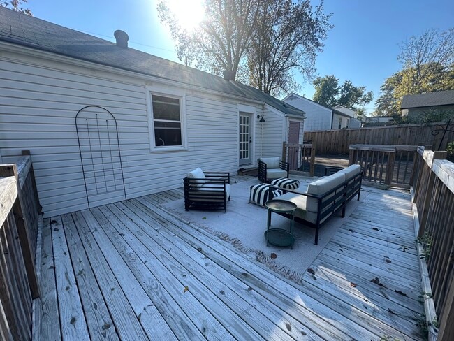 Back deck - comes with outdoor furniture. - 5623 Meadowcrest Ln