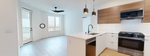 This contemporary 930 square foot apartment in San Diego offers a harmonious blend of style and functionality. The space features two bedrooms and two bathrooms, with the primary bedroom boasting a generous 150 square feet. The open-concept design seamlessly integrates the kitchen and living areas, creating an airy and spacious atmosphere.

The kitchen is a highlight, showcasing sleek cabinetry in a mix of white and wood tones, complemented by stainless steel appliances including a large refrigerator and built-in microwave. The bathroom exudes modern elegance with its clean lines, featuring a combination of wood and white elements, and a stylish bathtub with a curved shower rod.

Throughout the apartment, light wood flooring adds warmth and continuity. Large windows in the bedrooms and living areas flood the space with natural light and offer views of the surrounding area. The bedrooms are equipped with ample closet space, ensuring plenty of storage.

Additional features include recessed lighting, ceiling fans, and central air conditioning for year-round comfort. The property's location at 3585 Aero Court places residents in the heart of San Diego, offering the perfect balance of urban convenience and comfortable living.