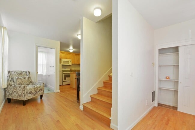 Entry way looking into living room, bathroom, kitchen, and stairway to upstair's bonus room - 1425 Madison St