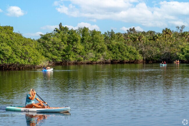 Water activities such as paddle boarding and boating are popular along the Caloosahatchee River.