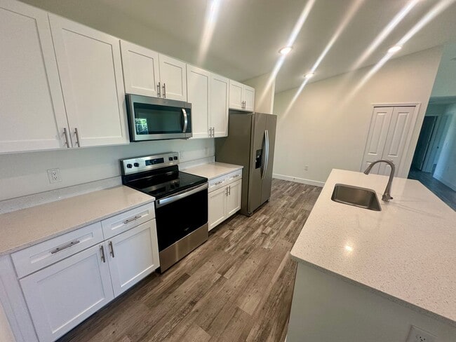 Building Photo - Available Now!! NW CAPE CORAL - 4 Bedrooms - 3 Bathrooms - 2 Car Garage