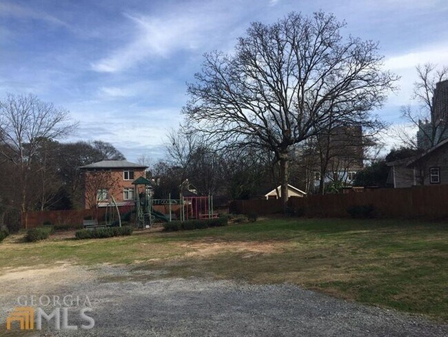 Community playground and garden next door - 1479 Groveland Ave NW
