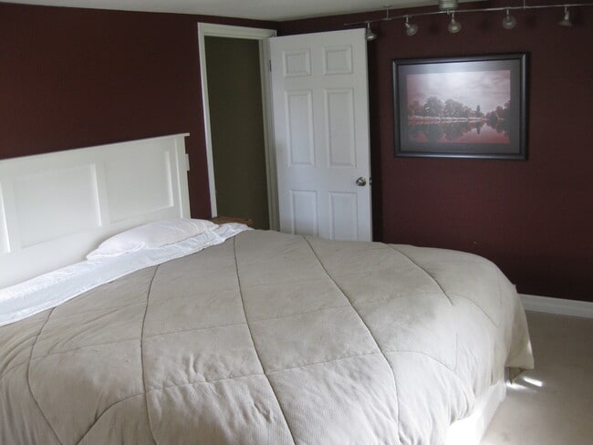 Master bedroom a half-level up from the main floor - 215 South 36th Avenue
