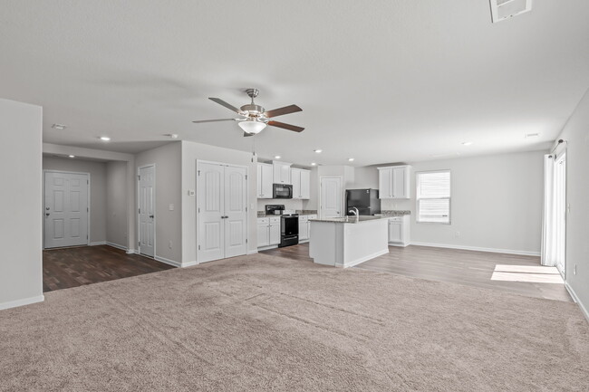 new LVP flooring throughout! All carpet in living room as been removed - 80 Doonbeg Dr