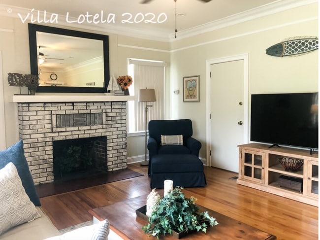 Comfy chair, nice sized tv and *nonworking fireplace - 636 E Cornell St