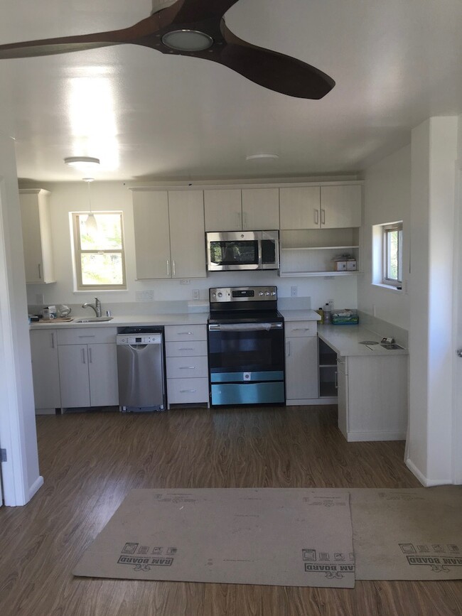 Full kitchen and full-size refrigerator - 1131 Mokapu Blvd