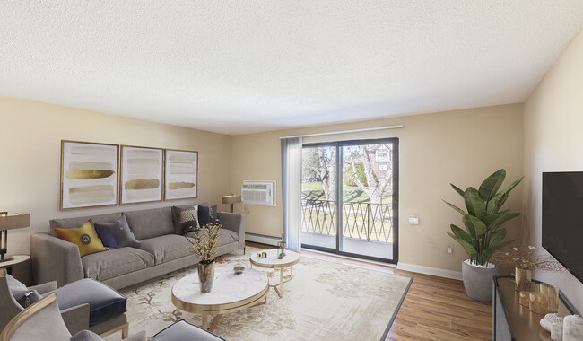 Spacious living room with balcony access and wood flooring - Royal Crest Marlboro Apartment Homes