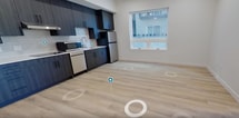 This compact yet well-designed apartment in Salt Lake City offers 480 square feet of thoughtfully arranged living space. The single-floor layout comprises one bedroom, one bathroom, and an open-concept kitchen and living area. The primary bedroom, measuring 110 square feet, provides a cozy retreat.

The apartment boasts modern finishes throughout, with light-toned wood-look flooring unifying the space. The kitchen features sleek dark cabinetry contrasting with stainless steel appliances and white countertops. Large windows in the living area and bedroom flood the space with natural light and offer city views, enhancing the sense of openness.

The bathroom is efficiently designed with a walk-in shower, modern fixtures, and ample storage. Recessed lighting throughout the apartment adds to the contemporary ambiance. The open floor plan maximizes the use of space, creating a seamless flow between the kitchen, living, and dining areas. This apartment is an ideal urban dwelling, combining functionality with modern aesthetics in a prime Salt Lake City location.