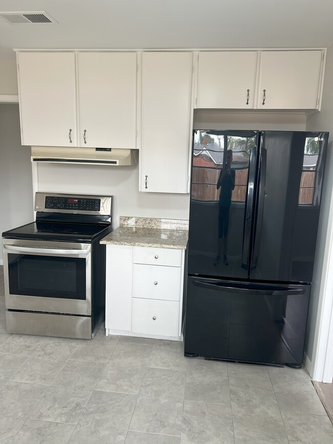 Stove and refrigerator - 3308 W Louisiana Ave