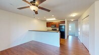 This 690 square foot apartment in West Lafayette, IN, offers a thoughtful layout maximizing space and functionality. The single-floor design includes one bedroom, measuring a generous 230 square feet, providing ample space for rest and relaxation. The apartment features a full bathroom equipped with modern fixtures, including a vanity with storage and a well-maintained toilet.

The kitchen is a highlight, boasting rich wood cabinetry, sleek black appliances, and a practical layout. Granite-look countertops add a touch of elegance, while the breakfast bar creates a seamless transition to the living area. The living room is bright and airy, featuring carpeted flooring and large windows that flood the space with natural light. A ceiling fan adds both style and comfort.

One of the apartment's key amenities is the in-unit laundry room, equipped with a full-sized washer and dryer. The room's wooden flooring matches that found in other areas of the apartment, creating a cohesive look throughout.

Overall, this apartment combines modern conveniences with a comfortable living space, ideal for those seeking a well-appointed home in West Lafayette.