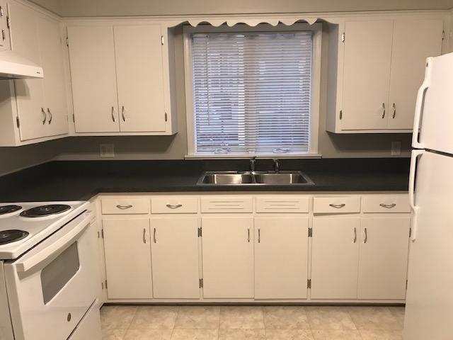 Large kitchen has many cabinets and a new electric range. - 509 W Marion St