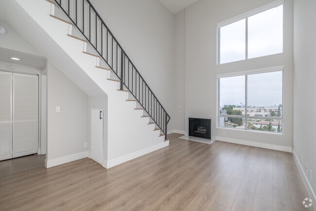 1BR + Loft, 1BA - 715SF - Living Room - The Norman