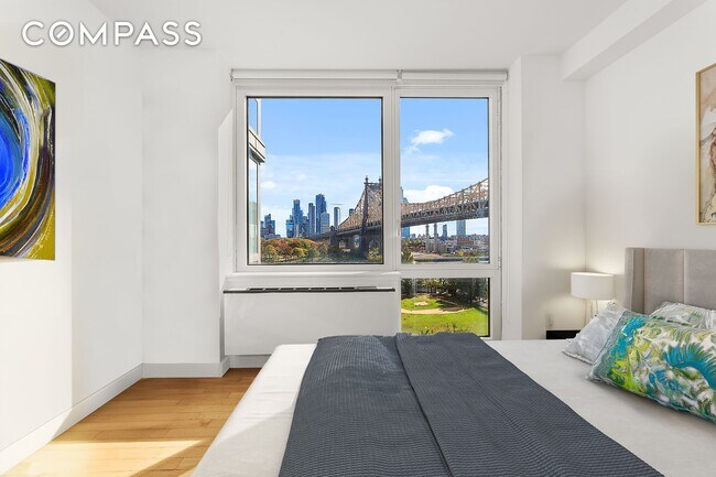 Foto del edificio - Skyline Splendor: Luxurious 2-Bedroom Retreat with Breathtaking NYC Views