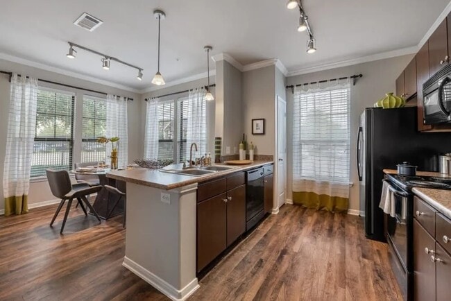 Building Photo - Elevated Comfort with Move-In Savings!