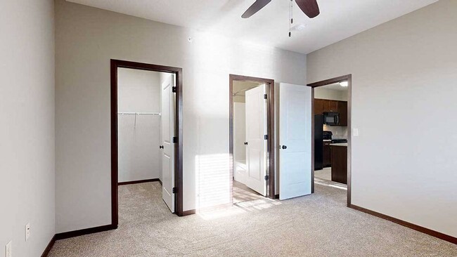 Our Fir Villa features a large walk-in closet and en suite bathroom in the bedroom. - The Villas at Wilderness Ridge