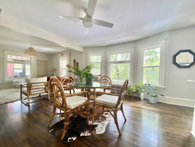 Large windows, including original stain-glass windows, throughout provide great lighting and views. - 1203 29th Ave NE