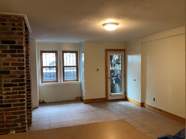 Security gates on front and back doors. - 608 1/2 Acker Place NE Townhome