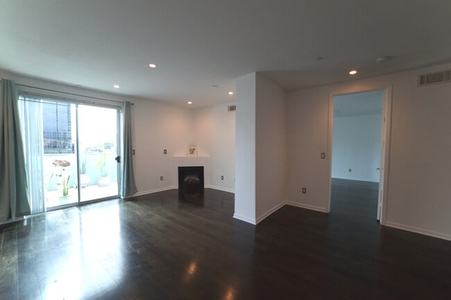 Living room fireplace - 637 S Fairfax Ave