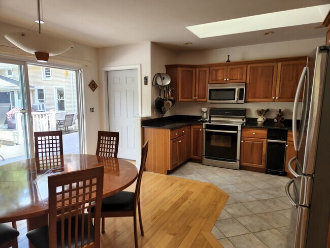 Kitchen feat' Granite counters, stainless steel appliances, cherry cabinets, hardwood & tile floors - 302 Amherst Rd