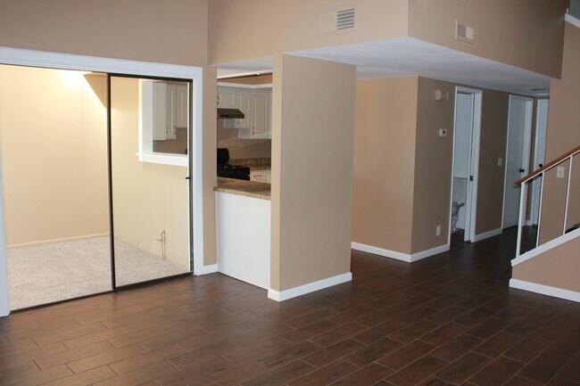 Right to left: Entry, half bath, kitchen, bonus room - 25 Quail Ridge Dr