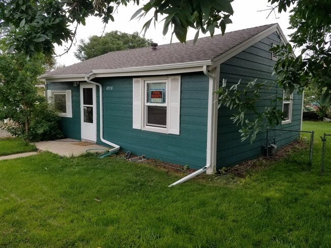 Building Photo - 6570 E 60th Ave