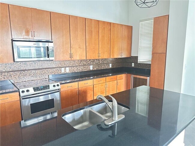Building Photo - 711 Cosmopolitan Dr NE