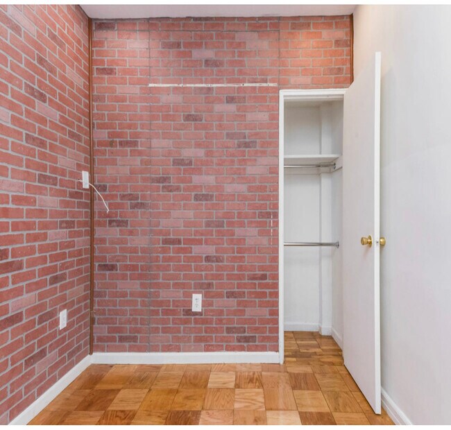 Inside the junior one bedroom. It fits a twin bed, dresser, and nightstand as well as the closet pictured. It can also be used as an office space, walk-in closet, storage, etc. - 2534 Crescent Street #LA
