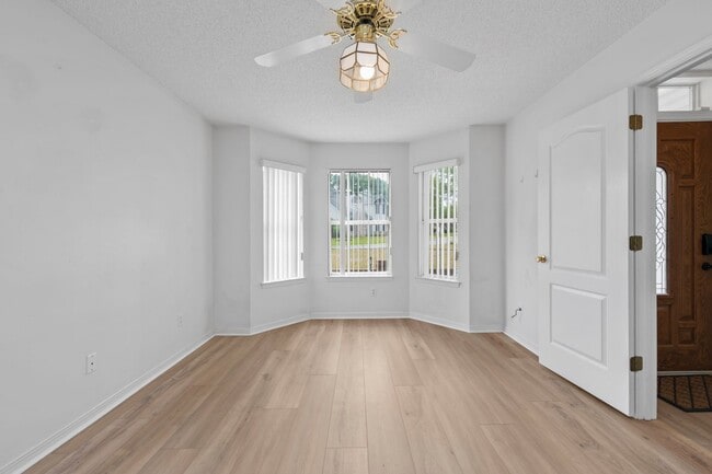 Building Photo - Spacious 3BR Retreat with Soaring Ceilings & Screened Porch