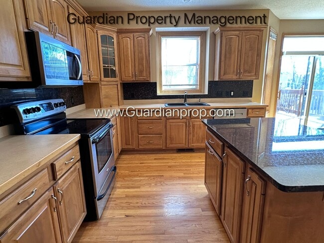 Building Photo - Brooklyn Park Single Family Home, Office, 3 Car Garage, New Carpet, Large Deck, Available Now