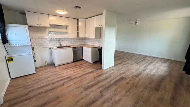 Open kitchen and living room. Kitchen is being finished now! - 1116 E Fountain Blvd