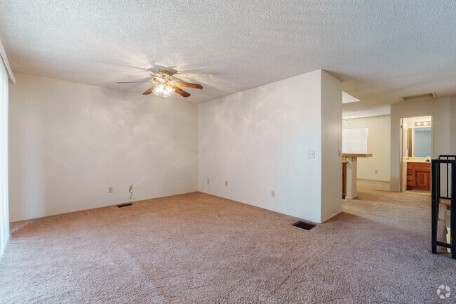 1BR, 1.5BA - 1,070SF - Living Room - Hacienda Court Apartments