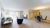 Located at 7085 W 130th St in Parma Heights, Ohio, this single-floor residence offers a well-organized layout designed for comfortable everyday living. The open living room is generously sized, finished with neutral-toned carpet, and filled with natural light through large sliding glass doors fitted with vertical blinds that lead to an outdoor area. The space flows seamlessly into a separate dining room, which features carpet flooring, a pendant light fixture, and a closet for added storage.

The kitchen is efficiently laid out with light wood cabinetry, a dual-basin sink, light countertops, and tile flooring. A window with vertical blinds allows natural light into the space, and there is room for a dining table within the kitchen as well.

Two bedrooms provide comfortable retreats, each featuring plush carpet, windows with exterior views, and ample room for furnishings. Both bathrooms are finished consistently with light wood vanity cabinetry, neutral tile flooring, and large mirrors with overhead lighting, offering a clean and functional design.

Throughout the residence, a cohesive neutral color palette of warm beiges and soft whites creates a calm, inviting ambiance, while the single-floor plan ensures easy accessibility and a practical flow between all living spaces.