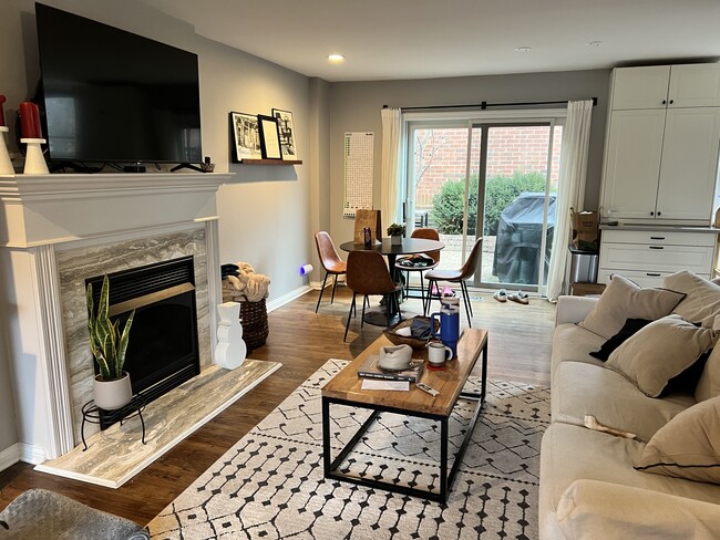 First floor living room with back door to back yard patio - 2141 N Larrabee St