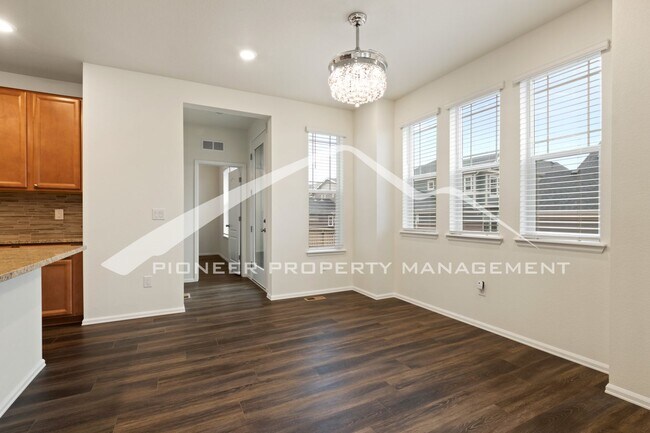 Building Photo - Modern townhome with a two car attached ga...