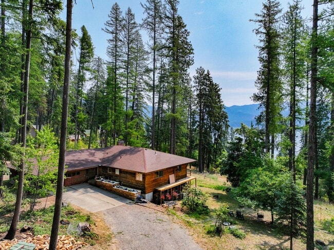 Building Photo - 2700 + sq ft family home has it all! Over 2 acres of land and a stunning view of Lake Pend Oreille