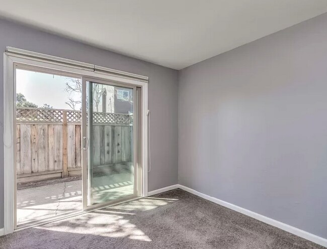 Bedroom has door to outside patio. - 1043 Highland St