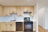 Located at 737 50th St NE in Washington, DC, this single-floor, 3-bedroom, 2-bathroom home offers a clean, modern aesthetic throughout. Light wood flooring runs continuously across the living spaces, creating a warm and cohesive feel. The open combined living and dining area is bright and airy, with natural light streaming through large windows and a wall-mounted mini-split unit providing efficient climate control.

The kitchen is well-appointed with light maple cabinetry, white countertops, a stainless steel sink, and black appliances including a range and dishwasher — offering a functional and stylish cooking space. Six closets distributed throughout the home provide generous storage options.

Each of the three bedrooms features the same warm wood flooring, natural light from windows with blinds, and individual wall-mounted mini-split units for personalized temperature control. The primary bedroom is a comfortable size with multiple doorways for flexible access.

The two bathrooms are finished with care: one features classic white subway tile surrounding a full soaking tub, while the other includes a warm wood-toned vanity, large-format tile flooring, and a subway-tiled shower. A dedicated laundry area adds further convenience to this thoughtfully laid-out home.