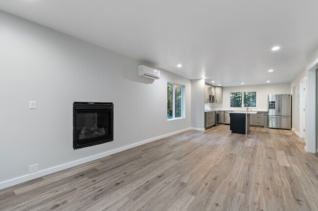 Open Floor Plan Living Room with propane fireplace, Dining Room & Kitchen - 8 White Mountain Ln