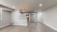 Located at 3241 Hulmeville Rd in Bensalem, PA, this thoughtfully designed 2-bedroom, 2-bathroom unit offers a clean, modern aesthetic throughout its well-appointed single-floor layout. The open-concept living and kitchen area is anchored by light gray luxury vinyl plank flooring and recessed lighting, creating a bright and welcoming atmosphere. The kitchen is a functional standout, featuring gray shaker-style cabinetry, a white quartz countertop with a peninsula breakfast bar, and a full suite of stainless steel appliances including a gas range, built-in microwave, dishwasher, and refrigerator. Pendant lighting above the peninsula adds a contemporary touch. The spacious primary bedroom offers generous closet space with sliding double doors, soft carpeting, and a window allowing natural light to filter in. The second bedroom is equally comfortable, also carpeted and naturally lit. Both bathrooms are finished with marble-style tile flooring, white vanities, and clean, minimalist fixtures. A dedicated hallway connects the private areas of the unit efficiently. With neutral tones throughout, recessed lighting, and modern finishes, this unit presents a cohesive and move-in-ready living space well-suited for everyday comfort.