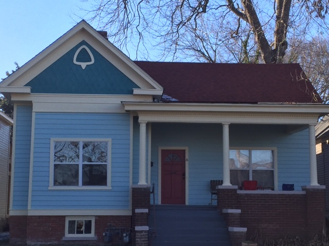 Newly renovated exterior siding, paint, with exposed metal eaves. - 1512 South Louisiana Street