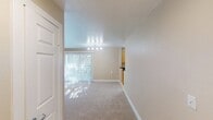 This 560 square foot apartment in the Highlands of Marin offers a thoughtful layout maximizing space and functionality. The kitchen is a standout feature, boasting light wood cabinetry, stainless steel appliances, and a galley-style design that optimizes workflow. The living area is bright and airy, with plush carpeting and a sliding glass door leading to a private balcony, providing an indoor-outdoor living experience.

The bedroom, measuring 150 square feet, offers ample space for a comfortable retreat. It features a large window for natural light and a spacious closet with sliding doors for storage. The bathroom is efficiently designed with a combined tub and shower, ensuring both practicality and comfort.

Throughout the apartment, neutral tones create a calm and inviting atmosphere, while the abundance of windows allows for plenty of natural light. The open floor plan between the kitchen and living area enhances the sense of space, making this compact apartment feel larger than its actual square footage suggests. Despite its modest size, this unit provides all the essentials for comfortable modern living in a desirable San Rafael location.