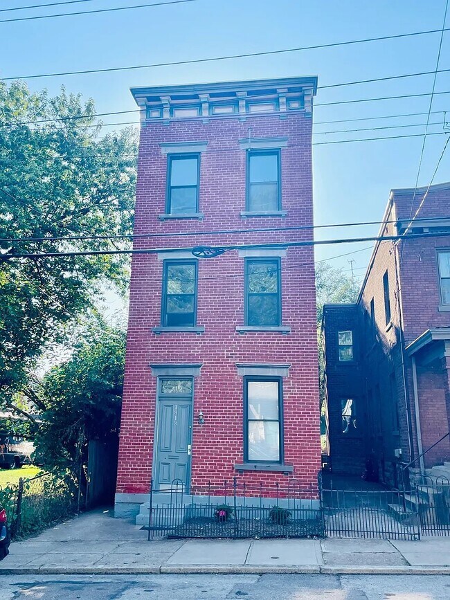 Front exterior of home. This apartment lies on the 2nd and 3rd floors - 1813 Highland Ave